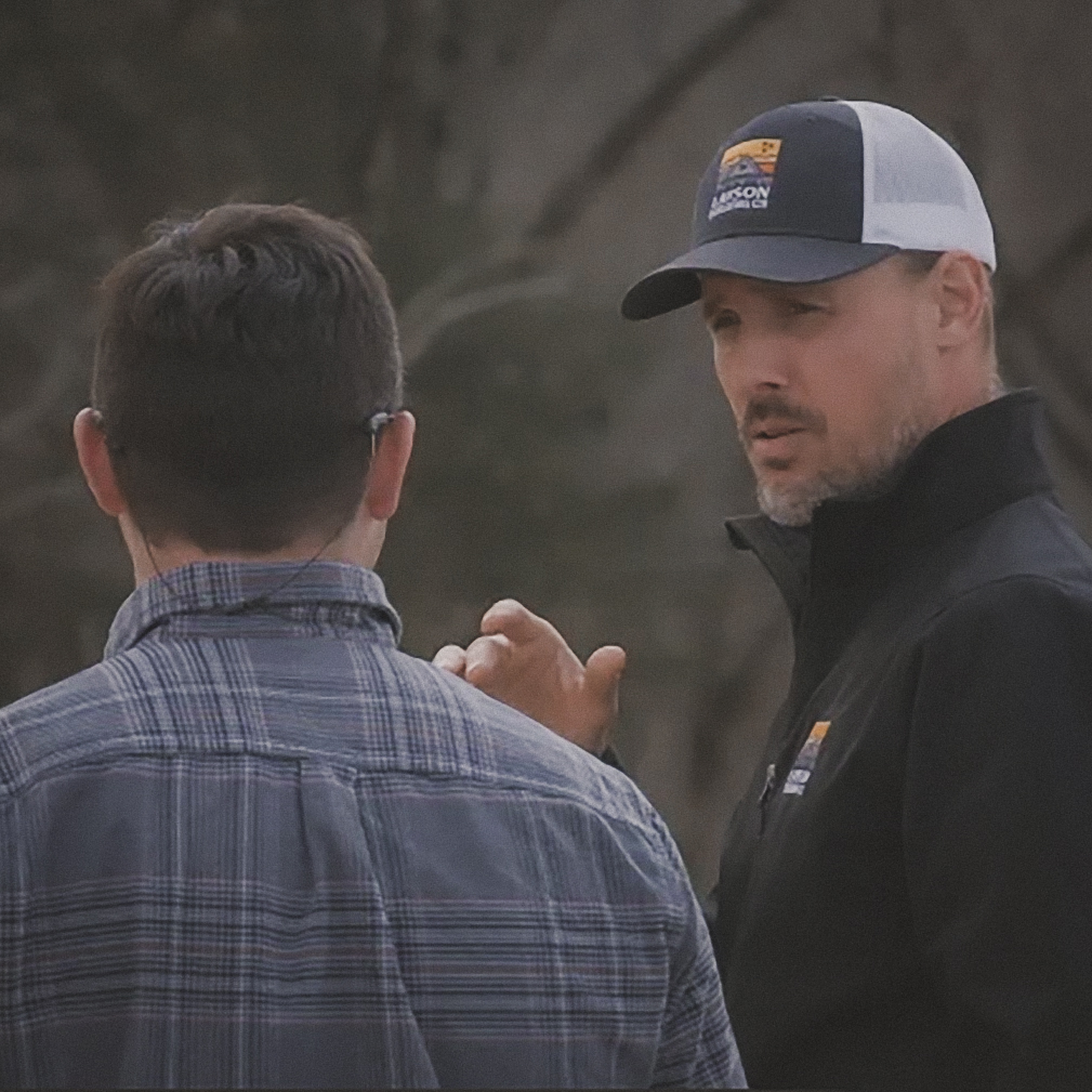 Brian Layson talking with a client.